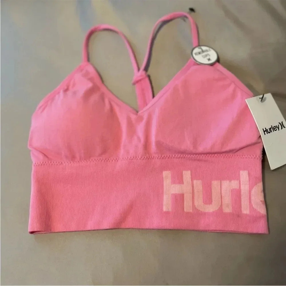 WOMENS HURLEY SEAMLESS RACERBACK
SPORTS BRA PINK/WHITE SIZE
SMALL
